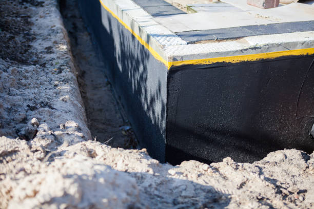 Professional Basement Waterproofing technician working in Colfax, IN